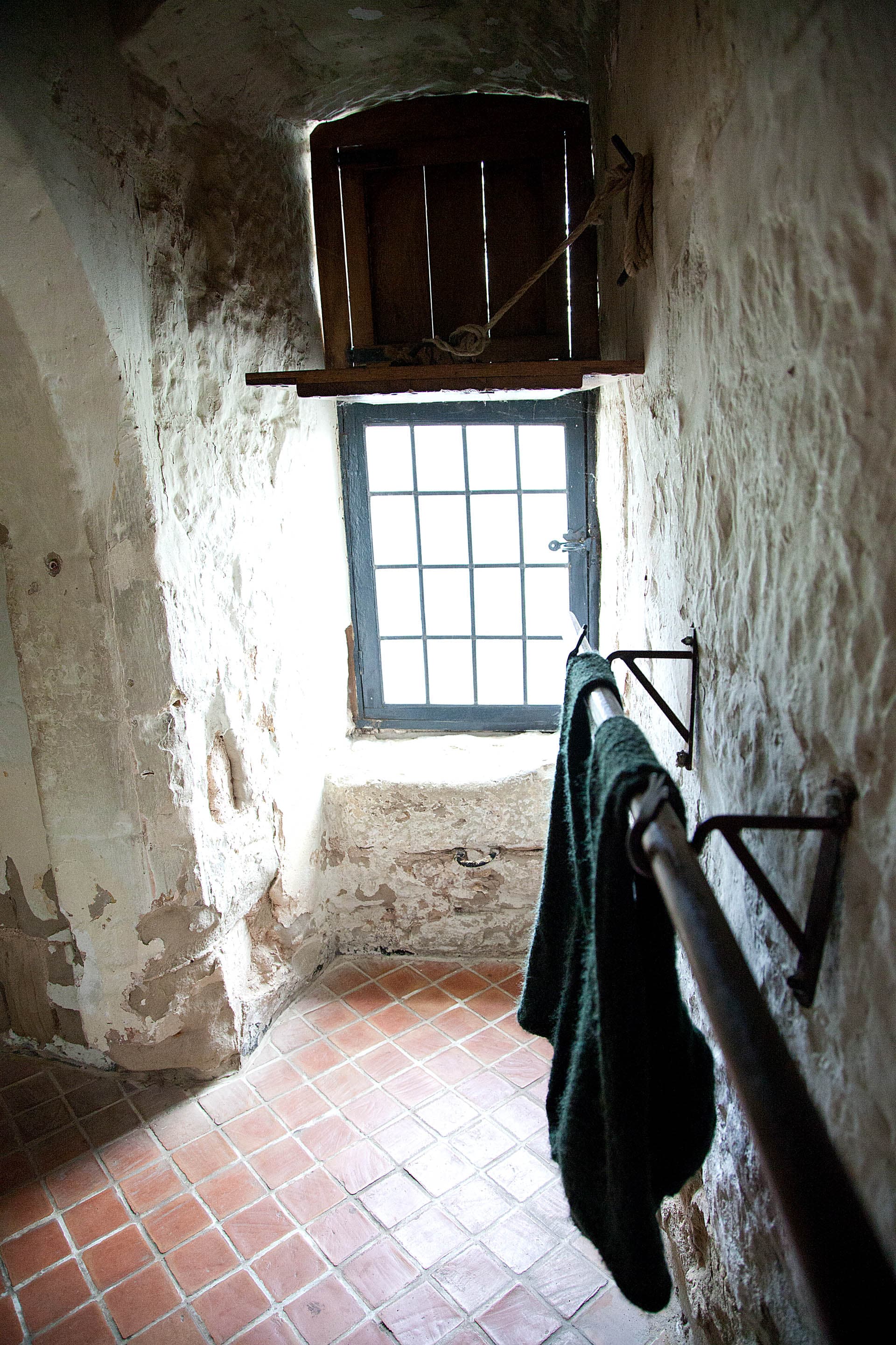 Daylight falling through an old stone window, used as a decorative interior photograph