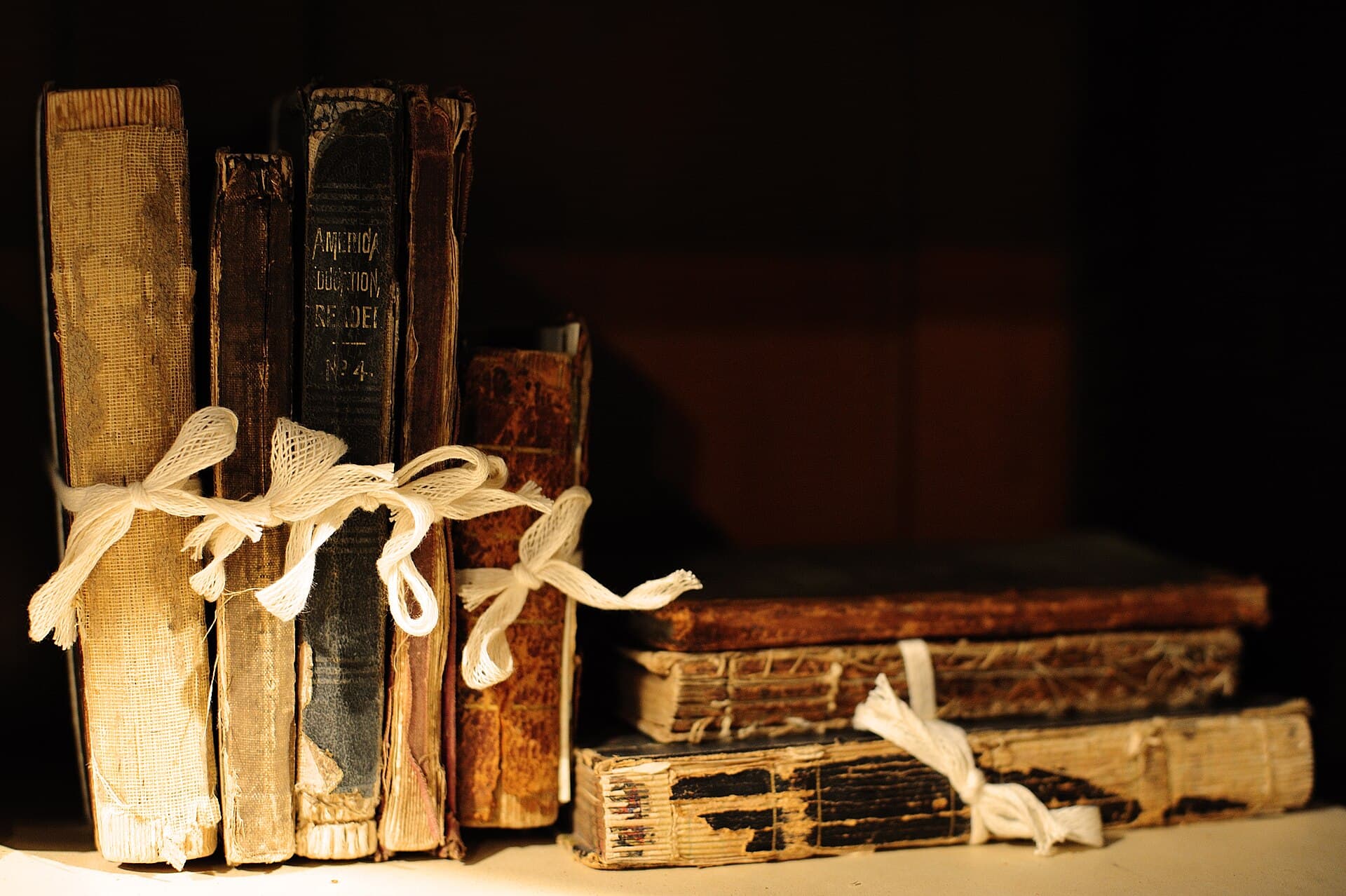 A stack of worn hardcover books